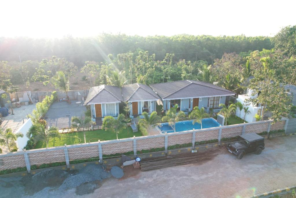 an aerial view of a house with a swimming pool at Eleven Eleven Villa in Pondicherry