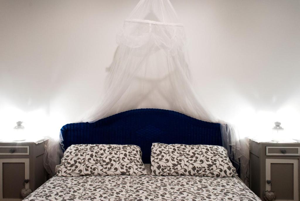 Postel nebo postele na pokoji v ubytování Vistazzurra B&B