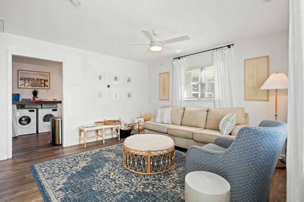 a living room with a couch and a table at The Crabby Seahorse in Emerald Isle