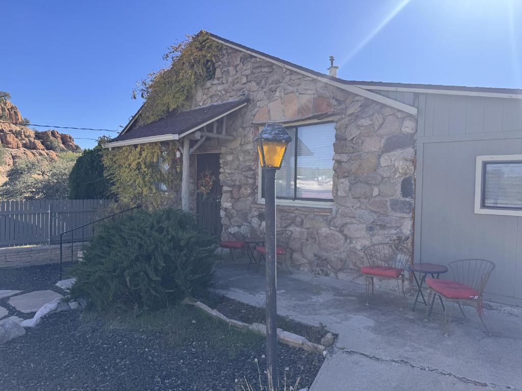 a stone house with a street light in front of it at Rustic Ridge in Granite Dells in Prescott