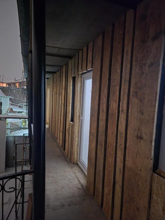 a hallway of a house with a door on the wall at White House in Gyumri