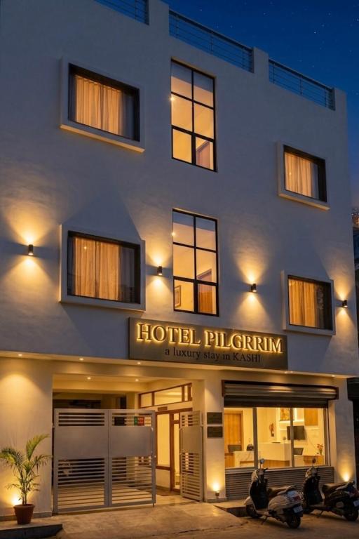 a hotel filbeckkin is lit up at night at Hotel Pilgrrim in Varanasi
