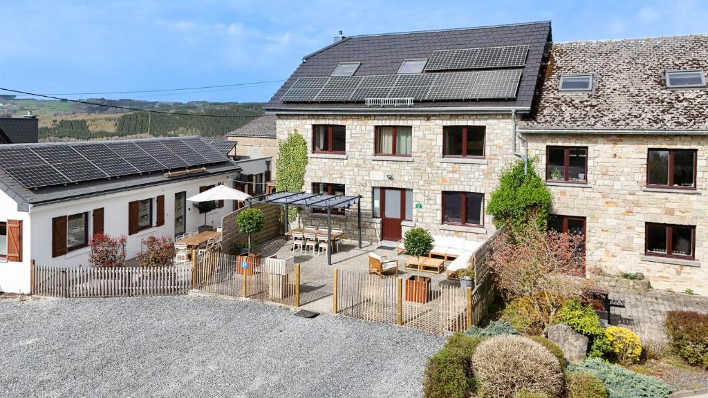 an image of a house with solar panels on it at Le gîte l'écureuil in Malmedy