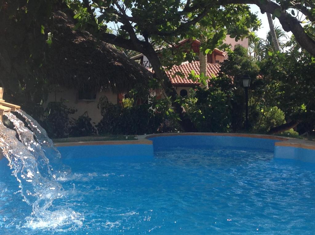 A piscina localizada em Pousada Villa Caju ou nos arredores