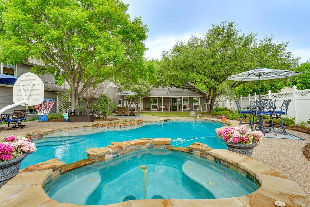 a swimming pool in a yard with trees and a house at Backyard Bungalow w/ Pool & Country Views in Argyle