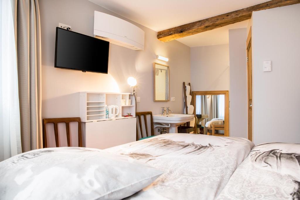 Postel nebo postele na pokoji v ubytování BnB City