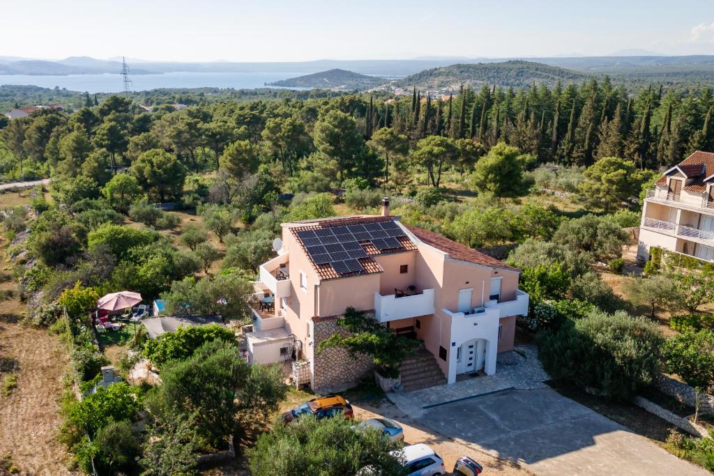 an aerial view of a house with solar panels on the roof at Dalmatian in Bilice