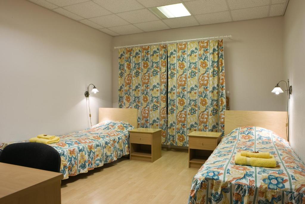 Postel nebo postele na pokoji v ubytování Posti Hostel