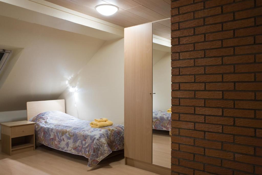 Postel nebo postele na pokoji v ubytování Posti Hostel