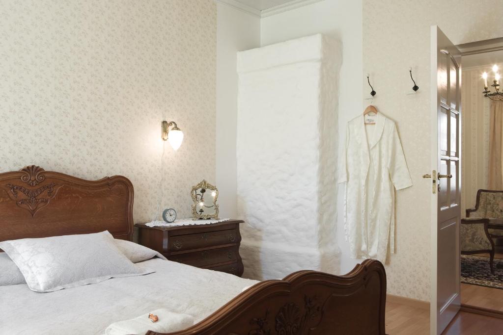Postel nebo postele na pokoji v ubytování Posti Hostel