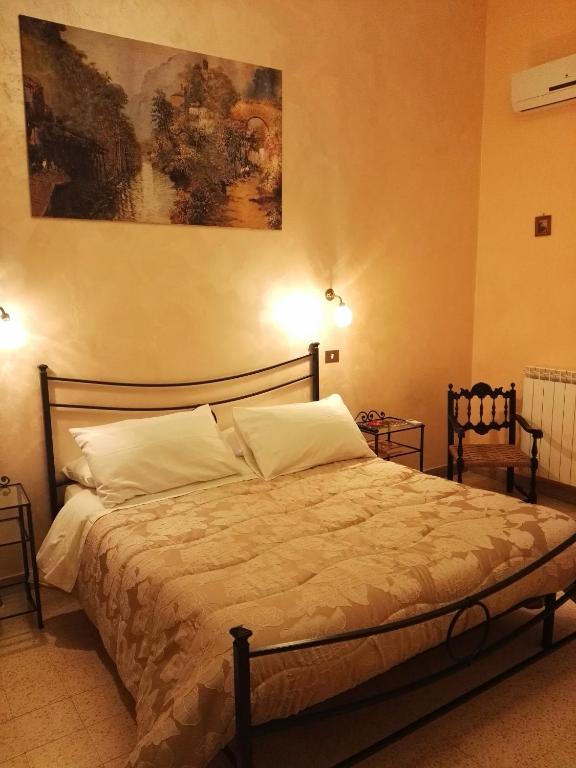 Postel nebo postele na pokoji v ubytování Domus Cicerone