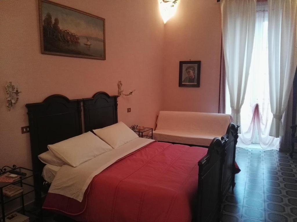 Postel nebo postele na pokoji v ubytování Domus Cicerone