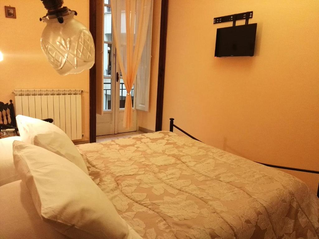 Postel nebo postele na pokoji v ubytování Domus Cicerone