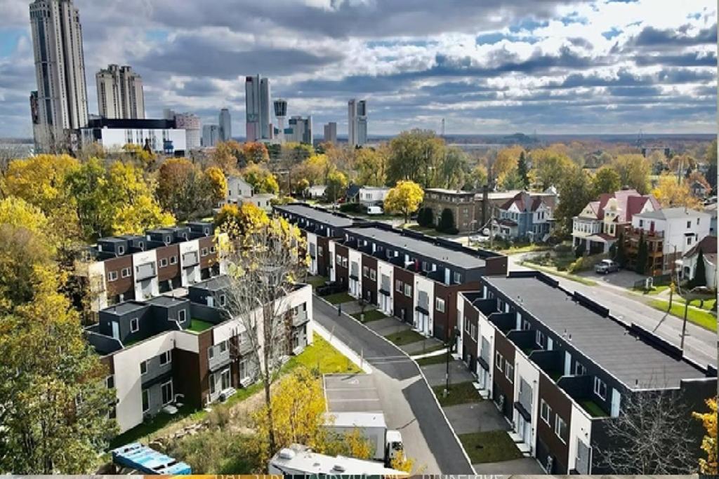 an aerial view of a city with buildings at Bentley Commons Fallsview - Luxury 4 Bedroom 4 Bath Townhouse in Niagara Falls