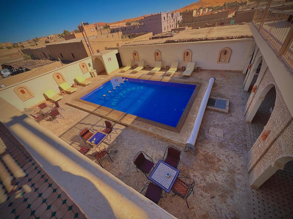 an overhead view of a swimming pool in a house at Riad camels house in Merzouga