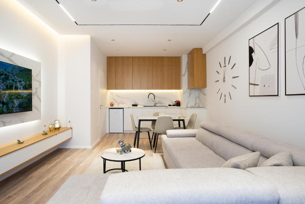 a living room with a couch and a table at TAO Apartment 2 in Tirana