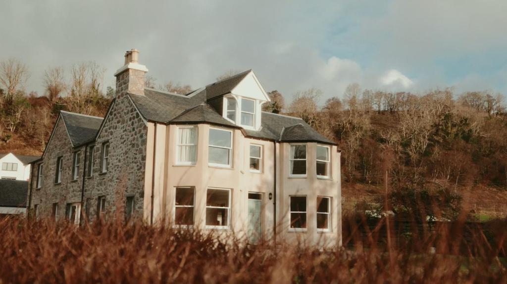 an old house with a chimney on top of it at Cuilcheanna House - near Glencoe - room only or breakfast available in Onich