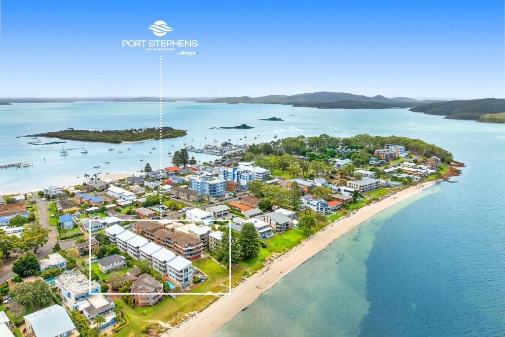an aerial view of a resort on a beach at Sunset Reset in Soldiers Point