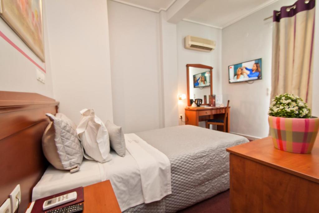 Postel nebo postele na pokoji v ubytování Triton Hotel Piraeus