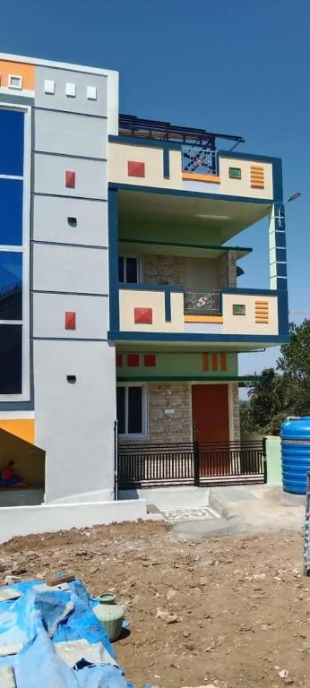 a building that is standing in the dirt at UP enterprices in Yercaud