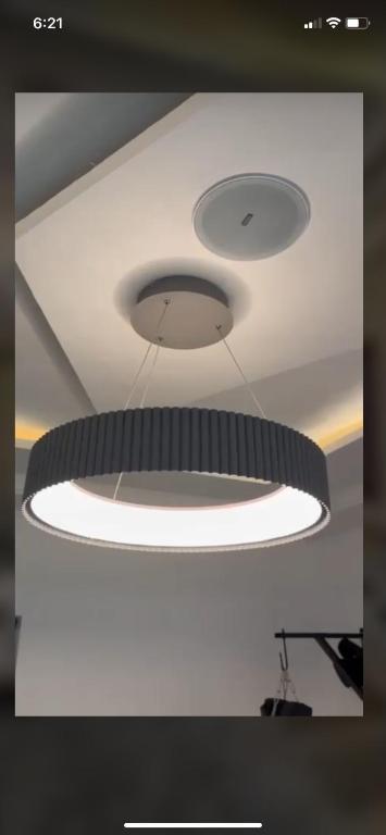 a large light hanging from a ceiling at 2 bedroom apartment in Nassarawa