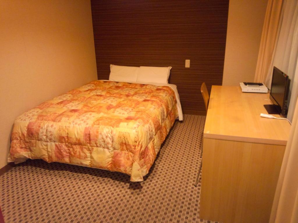 Postel nebo postele na pokoji v ubytování Hotel Matsumoto Hills