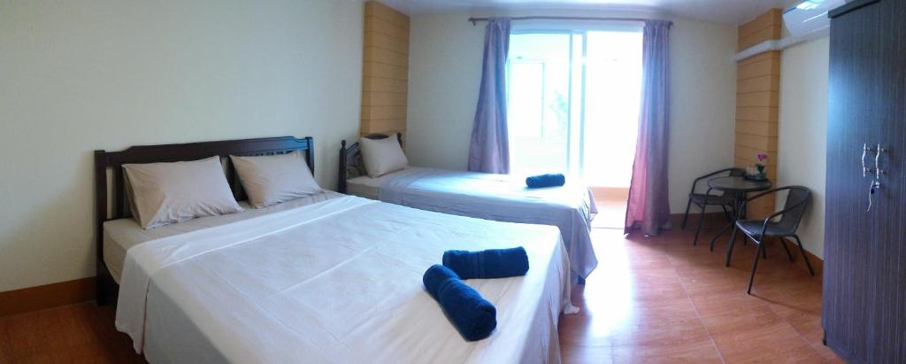 Postel nebo postele na pokoji v ubytování Relax Inn