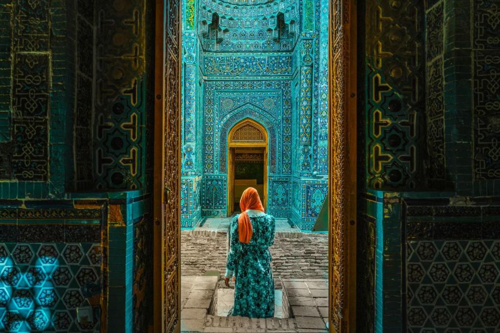 a woman in an orange hijab walking into a blue building at Khan Hotel Samarkand- UNESCO World Heritage Site in Samarkand