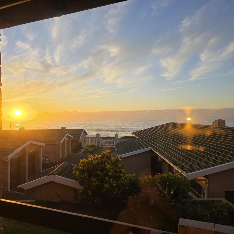 a view of the sunset from the balcony of a house at Allesreg Holiday Home in Margate