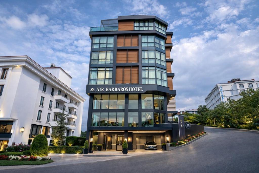 a tall building with a sign on the front of it at Air Barbaros Hotel Trabzon in Trabzon
