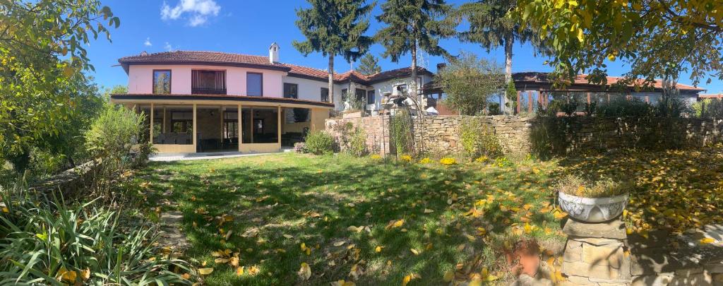 a house with a fence and a yard at The 3 Pines GuestHouse - Трите Бора in Dryanovo