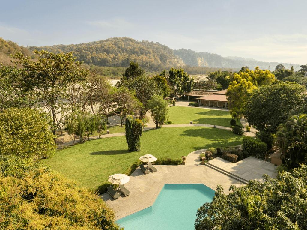 an aerial view of a park with a swimming pool at The Riverview Retreat Corbett by Leisure Hotels in Garjia