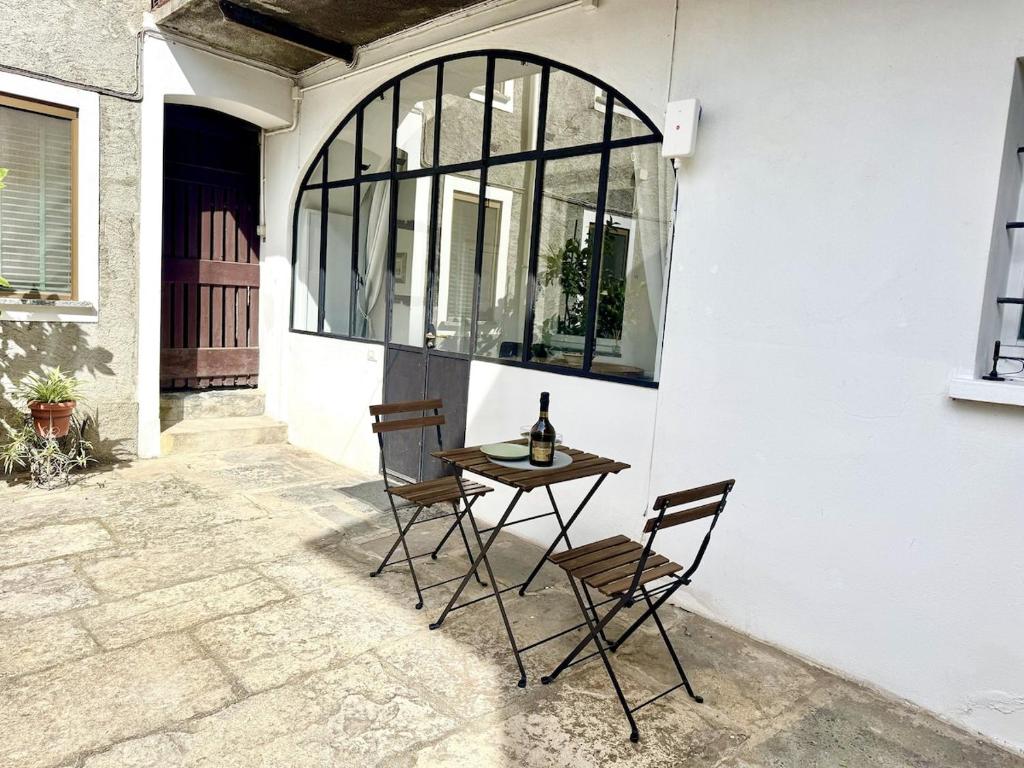 a table and two chairs on a patio at Laglio Cloud Nine, Como Lake in Laglio