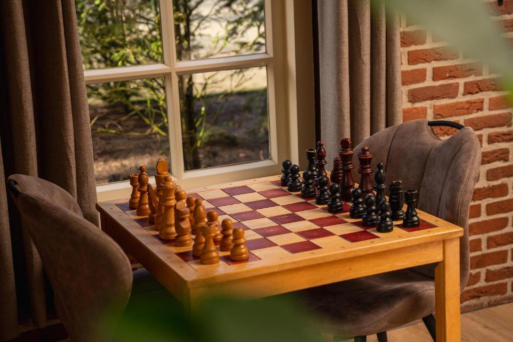 a chess board on a table with a chessboard at De Vuursteen | 10 - 40 pers. in Losser