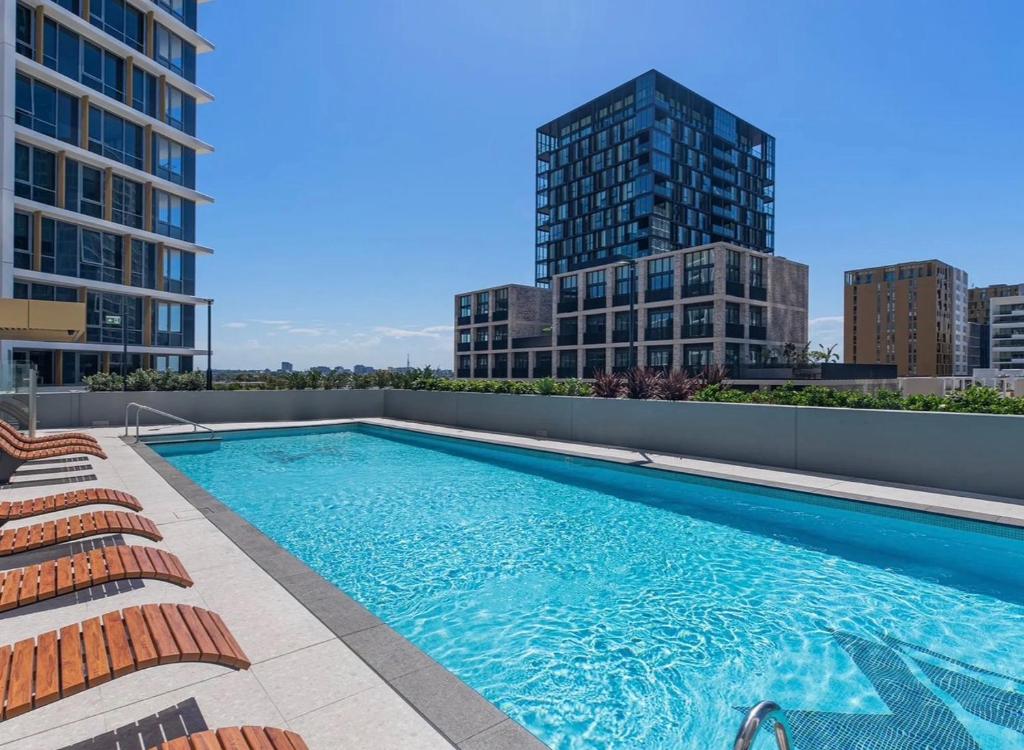 a swimming pool on the roof of a building at Olympic Optimum Accor in Sydney