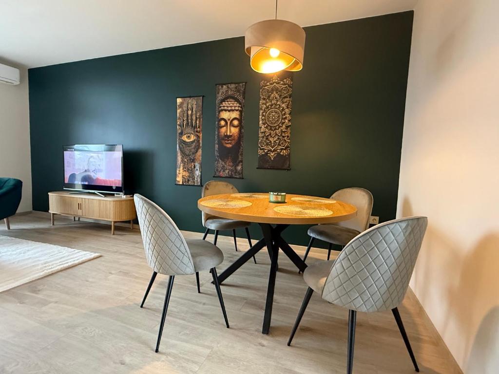 a dining room with a table and chairs at K&T Apartman in Szentendre