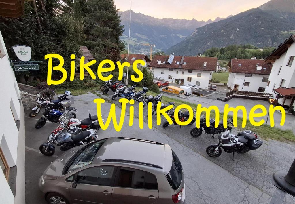a group of motorcycles parked in a parking lot at Pension Razil XO in Ladis