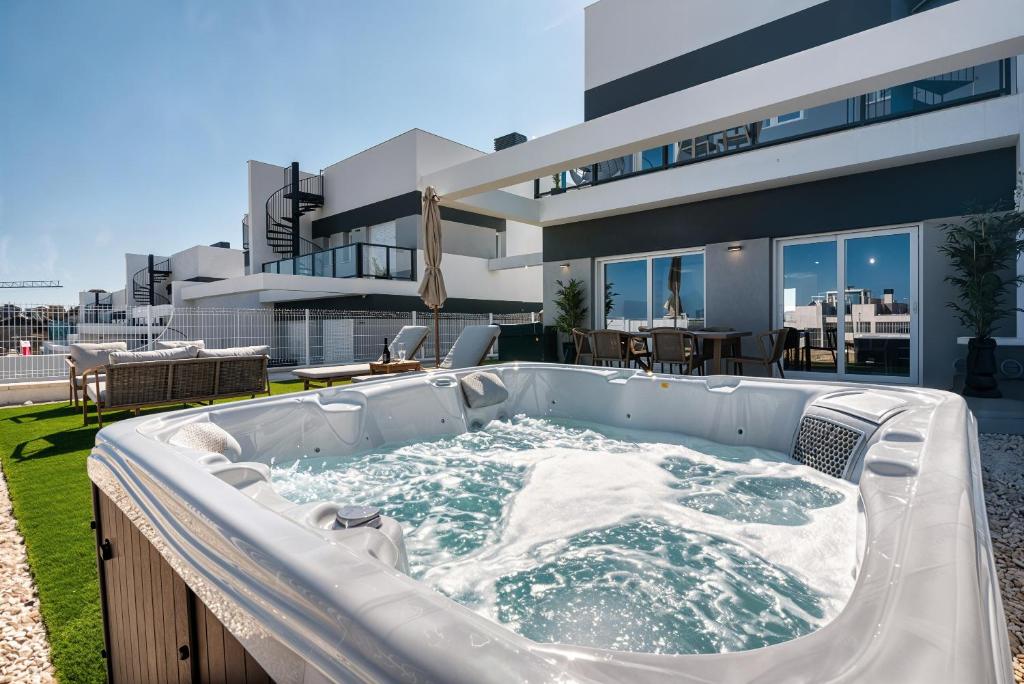 a hot tub in the backyard of a house at Stunning House, 3BR, HOT TUB, WIFI, Parking in Finestrat