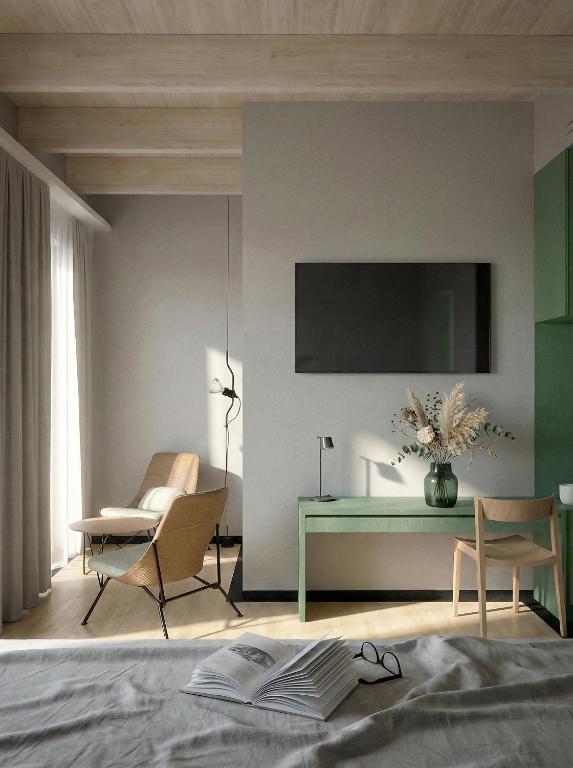 a bedroom with a bed and a desk and a chair at Vila Soča in Bovec