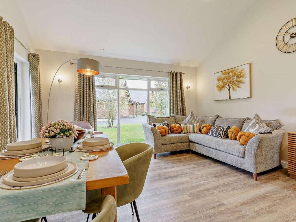 a living room with a couch and a table at 2 Bed in Swansea oc-91726 in Killay