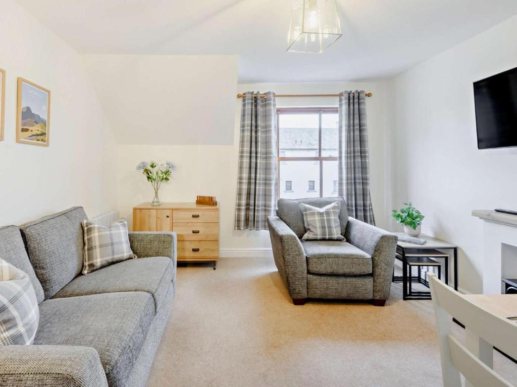 a living room with a couch and a chair at 2 Bed in Keswick oc-91901 in Keswick