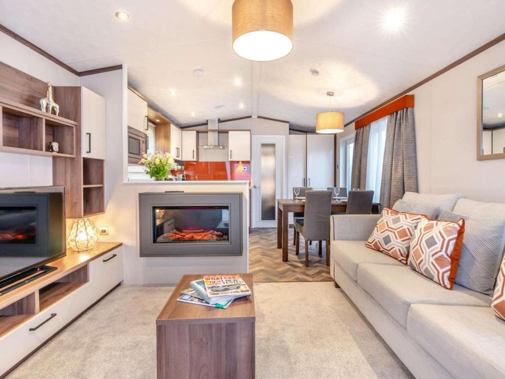 a living room with a couch and a fireplace at 2 Bed in St. Andrews oc-90763 in St. Andrews