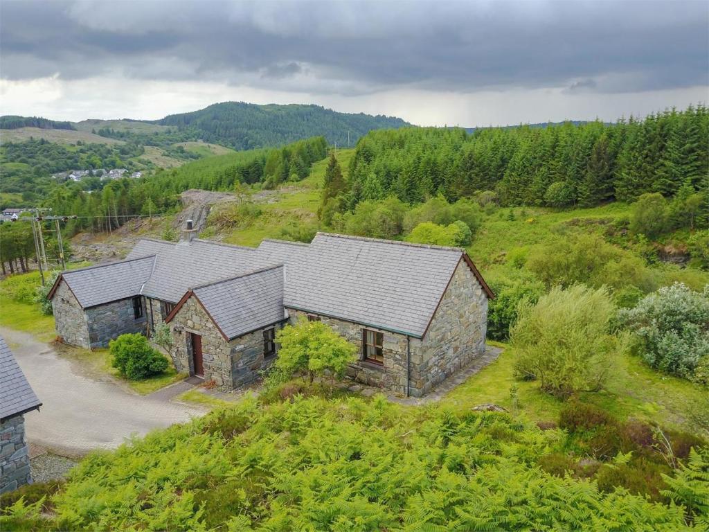 an aerial view of a stone building on a hill at 2 Bed in Lochgilphead oc-ca113 in Cairnbaan