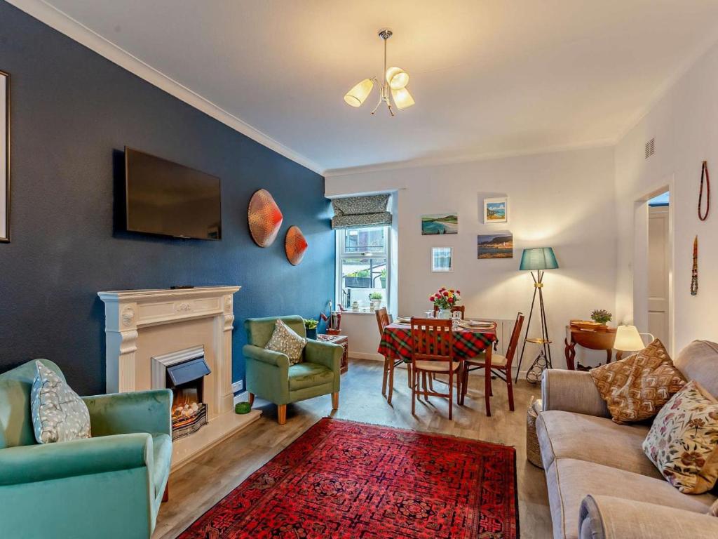 a living room with a couch and a fireplace at 1 Bed in Buckie oc-94536 in Cullen