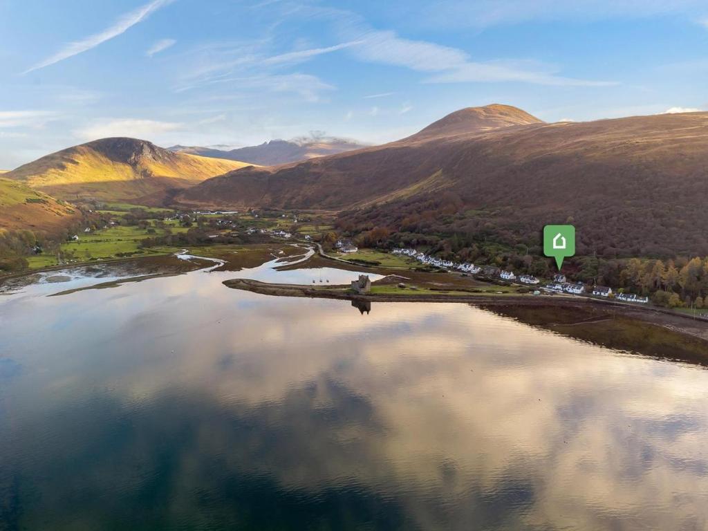 an aerial view of a lake in the mountains at 2 Bed in Isle Of Arran oc-77882 in Lochranza