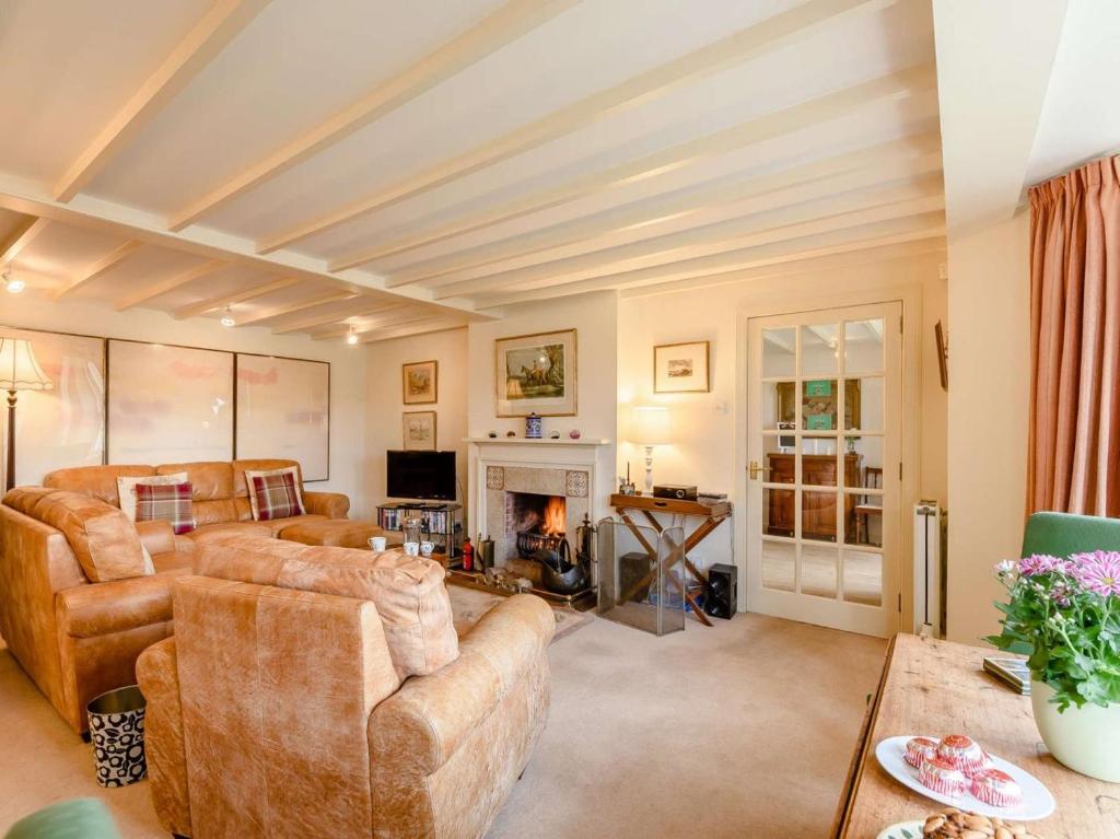 a living room with couches and a fireplace at 4 Bed in Ayr- oc-90038 in Ayr