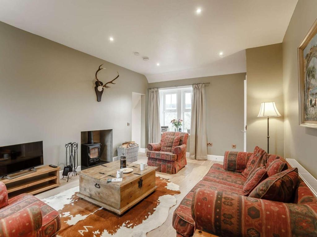 a living room with two couches and a coffee table at 2 Bed in Duns oc-82759 in Duns