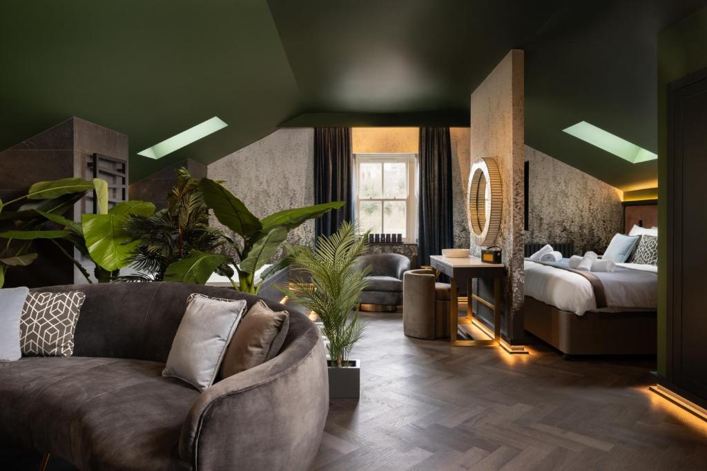 a living room with a couch and a bed at Sanctuary Knocker in Durham