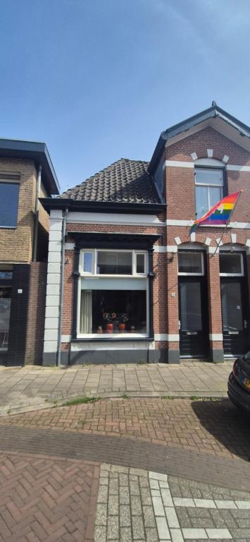 a house with a kite in the window of it at Spoor 24 in Dieren