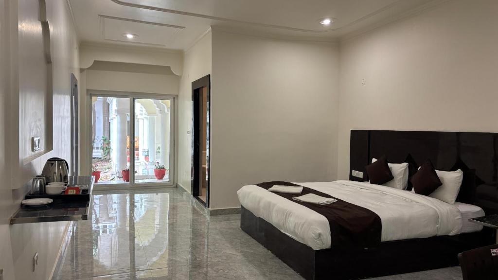 a bedroom with a large bed in a room at The Backpacker hostel by Surendra rajak in Khajurāho